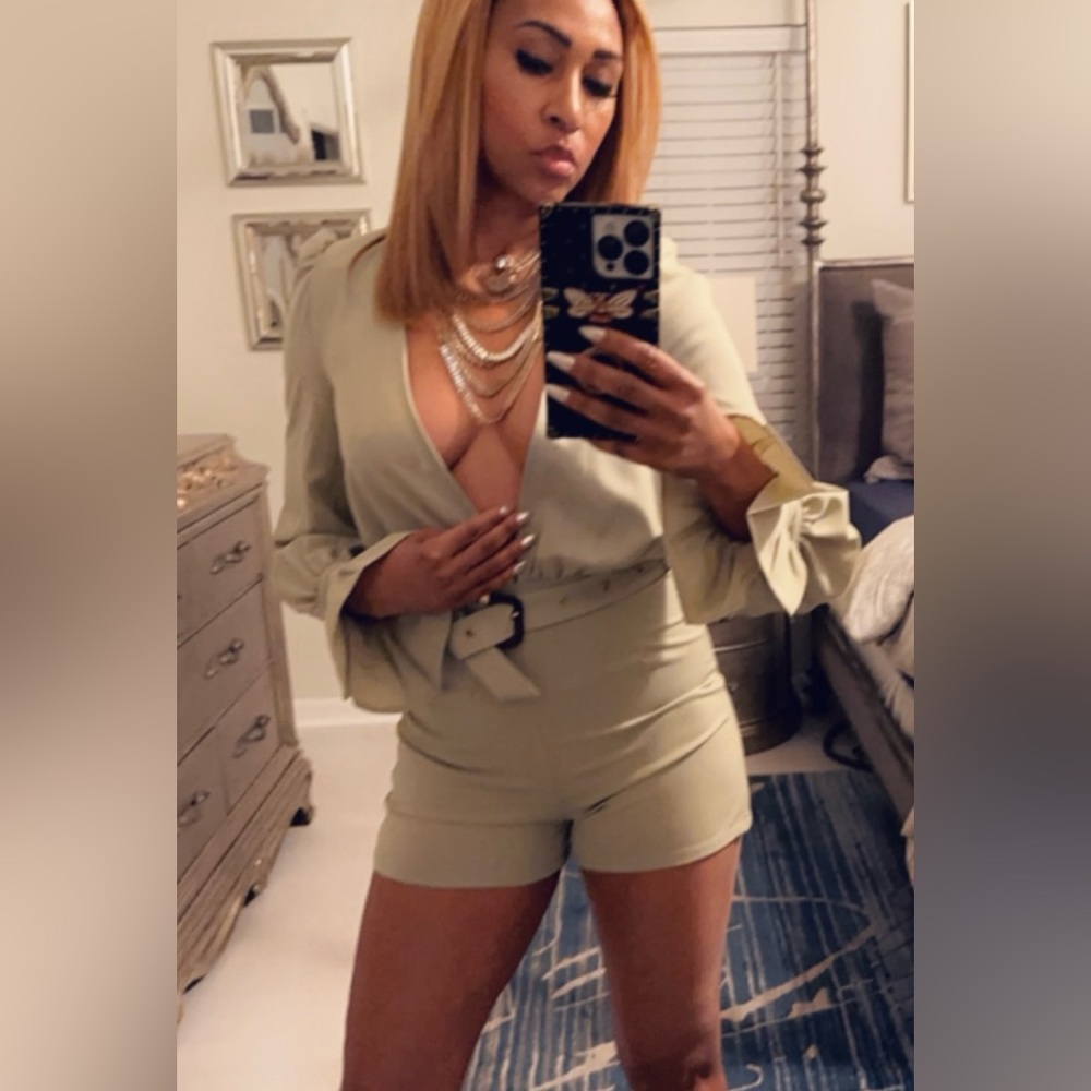 New with tags- light green romper with long sleeves.